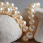 A vintage pearl necklace is a pre-owned string of pearls, typically at least 20-100 years old, prized for its unique character, historical significance, and often superior quality compared to modern counterparts, making it a coveted piece for collectors and fashion connoisseurs alike.